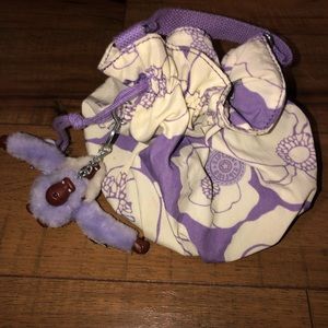 Kipling Clutch that has a short handle